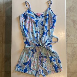 Blue Lilly Pulitzer sleeveless summer romper with a tie around the waist